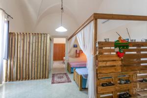 A bed or beds in a room at Casa vacanza Enea con idromassaggio - Apulia Home