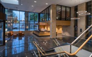 a lobby of a building with a fireplace at Maritim Hotel Ingolstadt in Ingolstadt