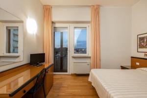 Cama o camas de una habitación en Hotel Nuova Grosseto