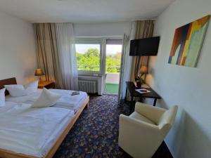 Postel nebo postele na pokoji v ubytování Apart Hotel Freiburg