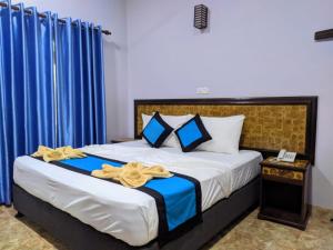Postel nebo postele na pokoji v ubytování Blue Sand Beach Resort