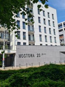 a building with the name of moskoonia on it at Mostowa 23 HUGO Apartment, self check-in 24h, free parking, air-conditioning in Poznań