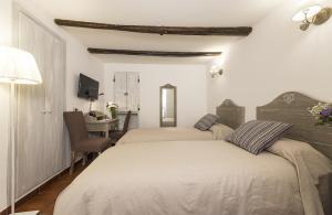 Postel nebo postele na pokoji v ubytování B&B I Tre Camini