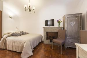 Postel nebo postele na pokoji v ubytování B&B I Tre Camini