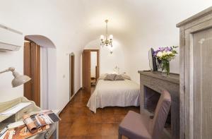 Postel nebo postele na pokoji v ubytování B&B I Tre Camini