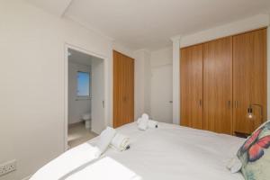 Ένα ή περισσότερα κρεβάτια σε δωμάτιο στο Horizon Bay 1505 by HMH +25 φωτογραφίες