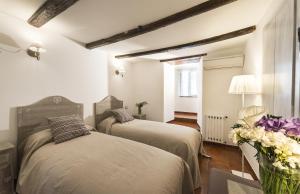 Postel nebo postele na pokoji v ubytování B&B I Tre Camini