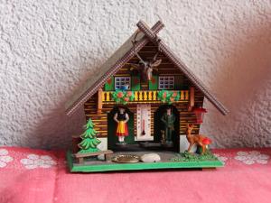 a model of a gingerbread house on a table at Apartment Le Geteillon 4 by Interhome in Chesières