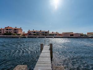 a dock in the middle of a body of water at Holiday Home Les Brigantins-1 by Interhome in Port Leucate