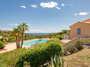 an image of a villa with a swimming pool at Apartment Les Hauts des Issambres-12 by Interhome in Les Issambres