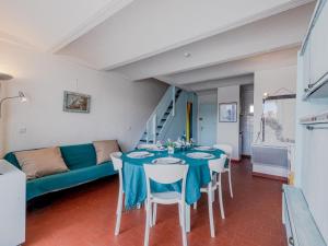 a living room with a table and a couch at Holiday Home Les Brigantins-3 by Interhome in Port Leucate +38 photos