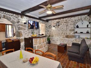 a living room with a table with bananas on it at Holiday Home Ivo - MKA230 by Interhome in Brela