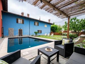 a villa with a swimming pool in a yard at Holiday Home La Grotta di Cech by Interhome in Narzole