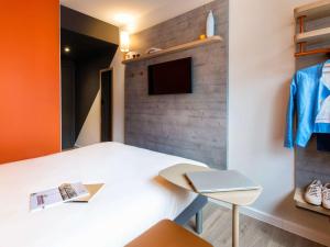 TV a/nebo společenská místnost v ubytování ibis budget Strasbourg Centre Republique