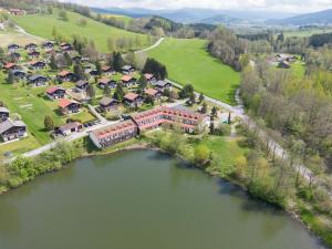 een luchtzicht op een gebouw naast een rivier bij Apartment Am Hohen Bogen-6 by Interhome in Arrach