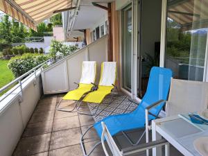 a balcony with two chairs and a table and a table at Apartment Vinzek by Interhome in Töschling +39 photos