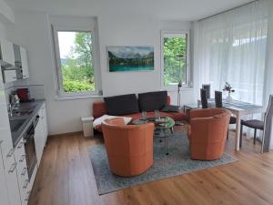 a living room with a couch and a table at Apartment Ferienwohnung Vinzek by Interhome in Töschling