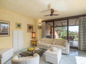 a living room with a couch and a table at Holiday Home Dalila by Interhome in Porto Istana