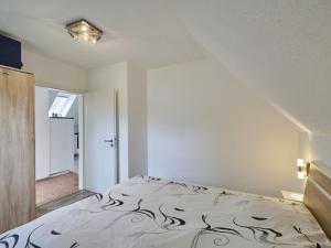 a bedroom with a bed in a room at Apartment Willingen by Interhome in Frankenau