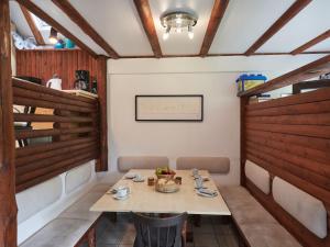 a dining room with a table and chairs at Holiday Home Aschenputtel by Interhome in Frankenau