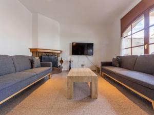 a living room with two couches and a coffee table at Holiday Home Residencial Port Lligat by Interhome in Torredembarra