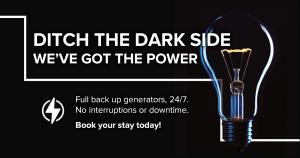 a advertisement with a light bulb on a black background at The Capital Mirage in Cape Town