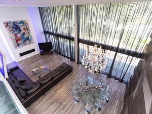 an aerial view of a living room with a chandelier at Holiday Home Nathalie by Interhome in Sant Antoni de Calonge