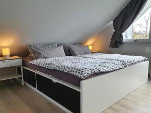 Postel nebo postele na pokoji v ubytování Ferienwohnung Sandgärten