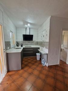 a kitchen with a sink and a counter top at Apartamento cerca de la playa in Chiclana de la Frontera