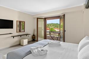 Postel nebo postele na pokoji v ubytování The Dandy Villas Sivota
