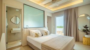 A bed or beds in a room at Fata Morgana Studios & Apartments