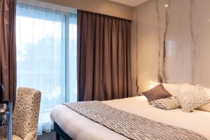Posteľ alebo postele v izbe v ubytovaní Hôtel d'Angleterre Rouen Centre Gare