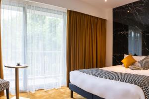 Posteľ alebo postele v izbe v ubytovaní Hôtel d'Angleterre Rouen Centre Gare