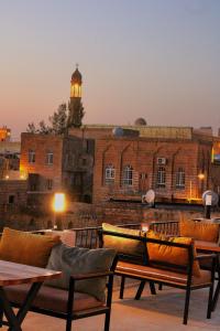 a building with a lighthouse on top of it at Mons Masius Boutique Hotel Cafe in Midyat