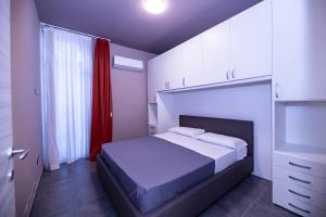 Postel nebo postele na pokoji v ubytování Eracle Hotel
