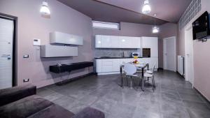 Kuchyň nebo kuchyňský kout v ubytování Eracle Hotel