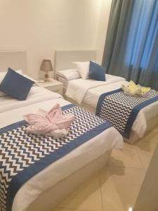 A bed or beds in a room at Sharm Hills