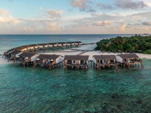 an aerial view of a resort in the ocean at Reethi Beach Resort in Baa Atoll