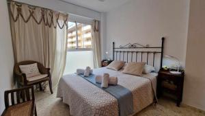 Posteľ alebo postele v izbe v ubytovaní V60 Apartamento 3 habitciones con vistas al mar