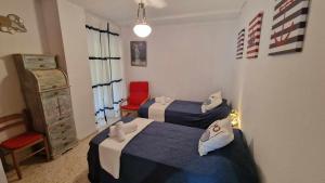 Posteľ alebo postele v izbe v ubytovaní V60 Apartamento 3 habitciones con vistas al mar