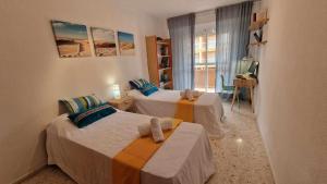 Posteľ alebo postele v izbe v ubytovaní V60 Apartamento 3 habitciones con vistas al mar