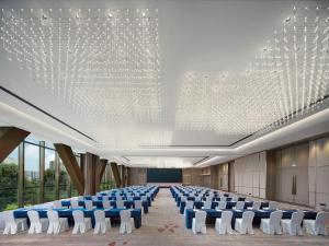 a large room with chairs and a large ceiling with lights at Crowne Plaza Hangzhou Linping, an IHG Hotel in Hangzhou