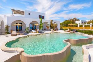 a pool in the backyard of a house at Beachfront Villa Crystalia in Lachania