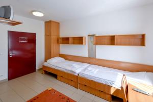 Postel nebo postele na pokoji v ubytování Campus Hotel