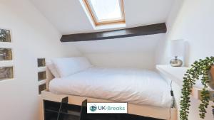 a bedroom with a bed on a box at Great location-Pet friendly Contractors welcome in Whitehaven