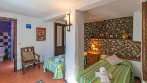 Łóżko lub łóżka w pokoju w obiekcie Villa Azul de Frigiliana by Ruralidays