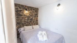 Łóżko lub łóżka w pokoju w obiekcie Villa Azul de Frigiliana by Ruralidays
