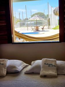 Postel nebo postele na pokoji v ubytování Cabanas da Sorte