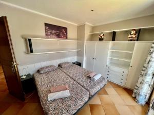 Łóżko lub łóżka w pokoju w obiekcie Finca Na Penyal 7