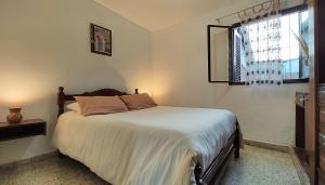 Postel nebo postele na pokoji v ubytování Casa Kuyay